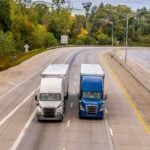 Photo by R9 Media Photo Collective: https://www.pexels.com/photo/freight-trucks-traveling-on-a-scenic-highway-40226285/